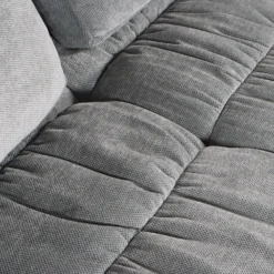 Sofa roulé et compressé dans une boite