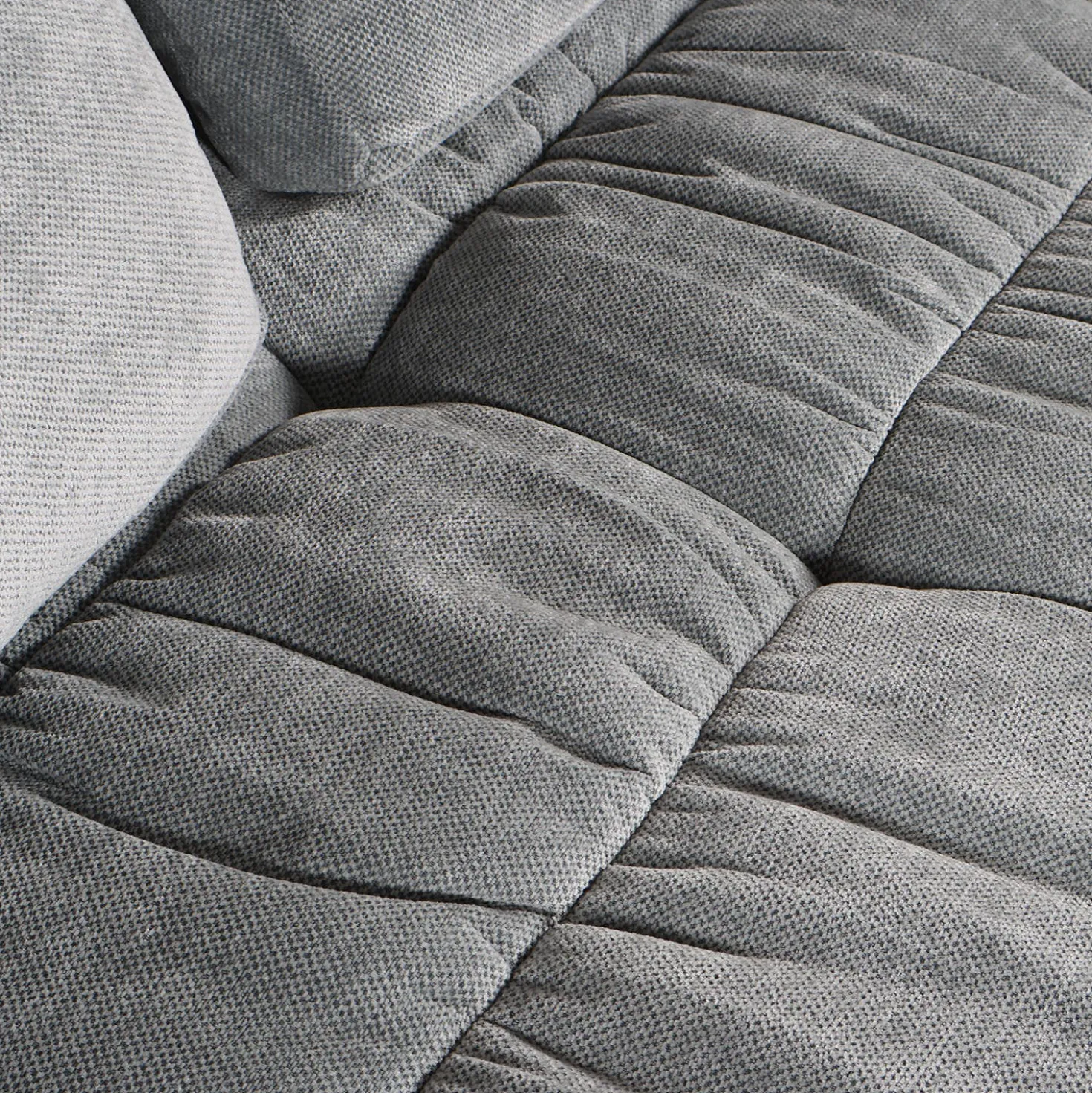 Sofa roulé et compressé dans une boite